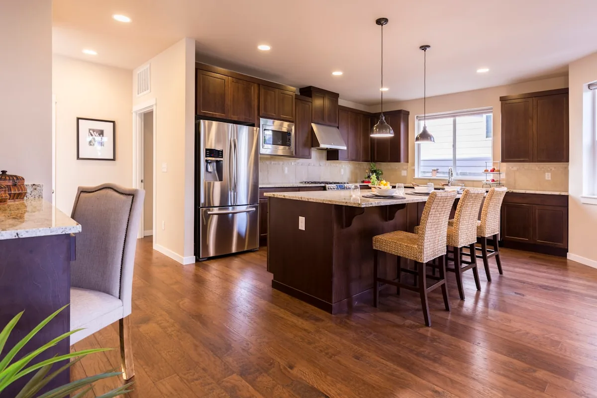 Traditional shaker-style kitchen cabinets with a dark wood island, Palo Alto