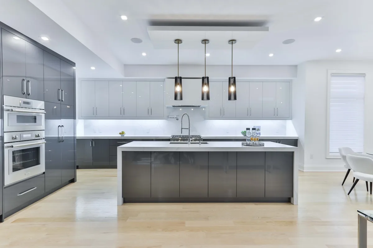 Full-custom kitchen with high-gloss gray cabinetry and a waterfall island, Palo Alto